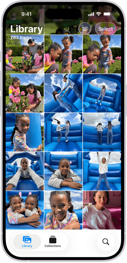 iPhone showing a photo library with children playing outdoors and on a blue inflatable slide